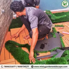 A behind the scenes look at our team meticulously cutting and fitting artificial grass and WPC tiles to create a custom flooring design for a balcony.