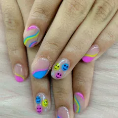Put a smile on your nails. This fun and playful design features a sheer base with colorful waves and cute, multi-colored smiley faces.