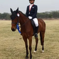 A young champion and his horse after a successful performance at the Delhi Horse Show 2024. We focus on building a strong bond between our riders and their horses.