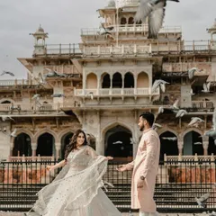 A moment of magic at Jaipur's Albert Hall Museum. The flock of pigeons taking flight adds a dynamic, unscripted layer to this royal portrait, blending classic architecture with spontaneous joy.