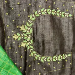 The back design of the embroidered Tussar blouse. I love creating these intricate patterns that add a surprise element to the outfit. This piece comes with two blouse options for versatility.