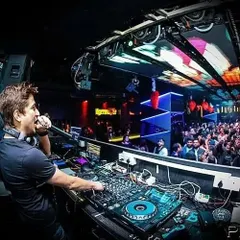 On the mic, interacting with the Saturday night crowd at Privee'. A DJ's job is to be the life of the party.