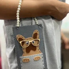 How adorable is this? One of our talented summer camp students crafted this dog-themed felt pouch, complete with hand-stitching and a cute pearl handle.