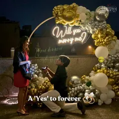 There’s nothing more special than being part of a 'yes' moment. For this rooftop proposal, we created a romantic circular arch with gold and silver chrome balloons and a custom "Will you marry me?" neon sign to make sure the memory would last a lifetime.
