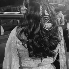 A black and white shot showing the beautiful texture of the waves and the placement of the passa, a traditional side accessory.