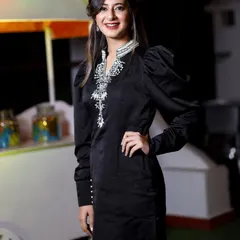 A guest poses confidently in a stylish black kurta with intricate silver embroidery. My portrait work focuses on highlighting the details of festive attire.