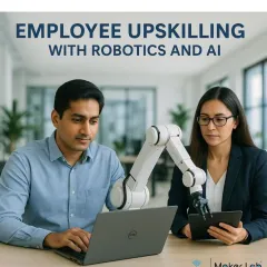 Our employee upskilling programs focus on tangible results, equipping your workforce with skills in robotics and AI. Here, two professionals work together on programming a collaborative robotic arm.