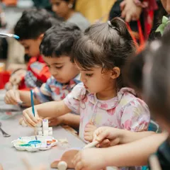 A young artist completely focused on her masterpiece. Our painting stations are designed to be accessible and fun for even the youngest party guests.