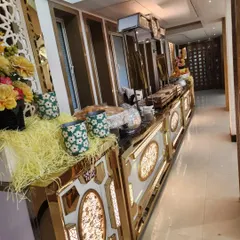 This is one of my premium buffet counter designs, featuring built-in lighting and elegant gold trim. I believe the food setup should be as impressive as the food itself, creating a luxurious atmosphere for your guests.