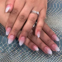 A classic pink and white ombre on a sharp, almond-shaped nail. This is a go-to look for elegance.