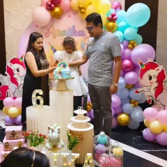The cake cutting moment is always special. Here, we see the family celebrating Annika's 6th birthday amidst the beautiful unicorn decor we planned and executed.