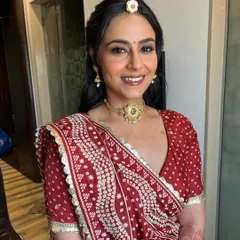 A final portrait of the bride, looking absolutely radiant. The makeup is soft, fresh, and enhances her natural beauty.