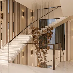 This angle showcases the staircase's floating design and the stunning, leaf-like metal sculpture that cascades down the stairwell, adding a touch of organic artistry to the modern space.