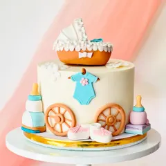 A charming baby shower cake designed to look like a baby carriage. It features a pram topper, a baby onesie, booties, and feeding bottles.