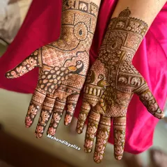 A gorgeous design featuring majestic peacocks and elephants, classic symbols of grace and royalty in Indian weddings. The lotus motifs on the fingers add a delicate touch.