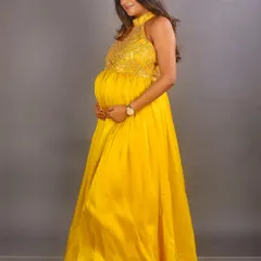 We also offer non-maternity gowns for pre-wedding shoots and other events. This hand-embroidered yellow satin gown is a vibrant and flowy option for any celebration.