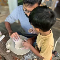 There is something truly special about watching a parent and child create together. This moment from a pottery retreat captures the quiet connection and shared focus that happens when you're shaping clay side-by-side.