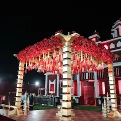 The centerpiece of the royal wedding was this magnificent mandap, heavily adorned with red roses and traditional hanging 'kaleeras', creating a stunning focal point.