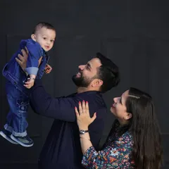Capturing the pure joy of a father lifting his son. Even in a studio setting, I encourage playful interactions to get those genuine, happy expressions.