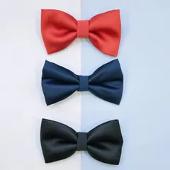 Our classic bows are perfect for any look. This image displays our simple yet elegant satin bow ties for men, available in essential colors like red, navy, and black.