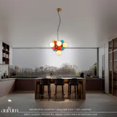 This playful, multi-colored disc pendant adds a pop of color and personality to a modern kitchen. It’s a statement piece that proves luxury lighting can also be vibrant and fun.