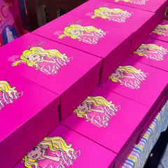The fun doesn't stop when the party ends. These custom Barbie-themed party favor boxes were filled with goodies for the guests to take home as a memory of a fantastic day.