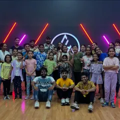 A huge group of dancers, including lots of kids, after a workshop. My classes are open to all ages and create a fun family atmosphere.