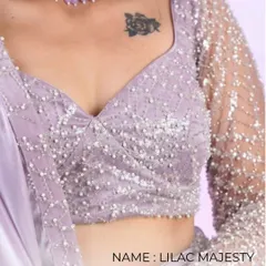 Lilac Majesty. A close-up of the beautiful embroidery and pearl work on this lilac blouse. The fabric and details are what make it a masterpiece.
