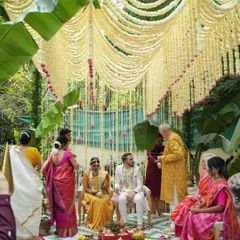 An intimate wedding ceremony doesn't mean compromising on beauty. This mandap, created with curtains of fragrant tuberose and framed by lush banana leaves, was designed to feel both sacred and deeply personal for a beautiful South Indian wedding.