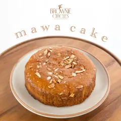 This is my Mawa Cake, a nod to the classic Parsi bakery treat. It's a rich, dense, buttery cake made with milk solids and topped with sliced almonds.