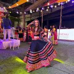 Feeling the festive lights and music at a Navratri night event. My personal style is a mix of traditional grace and modern energy.
