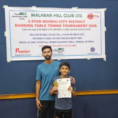 Another one of our promising young players with his coach and trophy at the Malabar Hill Club district tournament. This one-on-one encouragement is a key part of our coaching style.