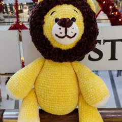 My 22-inch tall lion plushie, made with super soft velvet yarn. This was a challenging but rewarding project.