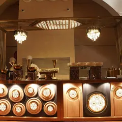 This is an example of one of my grand buffet setups. I focus on creating an artistic and inviting display with custom lighting and elegant serveware, making the food counter a true centerpiece of the event.