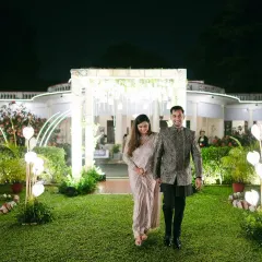 We believe in crafting beautiful entrances that set the tone for the entire evening. For Ayesha and Abhishek's garden reception, we designed this elegant walkway with heart-shaped lights, leading them into a night of celebration.