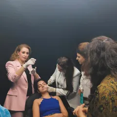 As an educator, I often guide other doctors during training sessions. Here, we are demonstrating the proper technique for administering fillers during the Juvederm Skinvive launch event. This collaborative learning ensures the highest standards of care across our field.