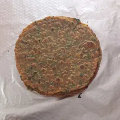 A simple stack of our soft, homemade methi theplas. We make these traditional Gujarati flatbreads with fresh fenugreek leaves and whole wheat flour, perfect for a quick snack or as part of a larger meal.