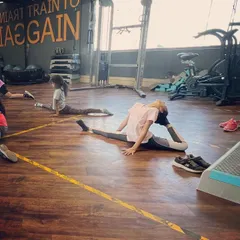 A young dancer demonstrates impressive flexibility with a full split and backbend. We focus on individual progress, celebrating each student's achievements.