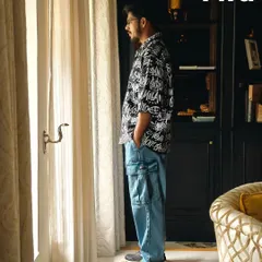 A side-profile shot from the H&M and Myntra FWD campaign. This angle highlights the relaxed fit of the outfit and creates a contemplative mood, adding depth to the fashion story.