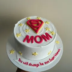 A "Super Mom" cake with a Superman-style logo, because moms are the real superheroes.