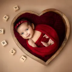 A classic and timeless portrait. I use soft wraps and beautiful props like this heart-shaped wooden bowl to create artistic, peaceful images of your newborn.