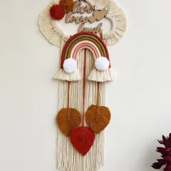 This "Live Love Laugh" rainbow hanging is a wonderful reminder to cherish every day. I made this for a couple, and the earthy rainbow tones and hanging leaves give it a warm, rustic feel.