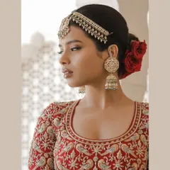 A stunning close-up bridal portrait in Jaipur, highlighting the flawless makeup and regal jewelry.