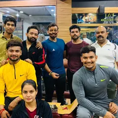 The birthday boy gets some cake on his face. We always have a bit of fun and masti during our celebrations at the gym.