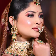 A radiant bridal glow is essential. This profile view showcases the seamless highlighter and blush application, creating a healthy, glowing-from-within look that photographs beautifully.