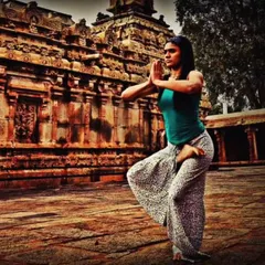 Finding stillness in sacred spaces. Here, I am practicing a balancing asana in front of an ancient temple, drawing energy from the history and spirituality of the place. My retreats often include visits to such culturally rich sites.