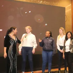 Bringing employees on stage for a group activity is a fantastic way to build team spirit. These shared experiences are perfect for team bonding and creating positive memories that last long after the corporate event is over.