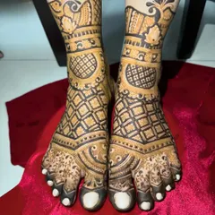 A close-up of a similar design, showing the fine lines and detailed patterns that cover the entire foot.