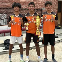 Three of our U15 champions posing with their trophies after a dominant, undefeated season in the Gurgaon Youth League.