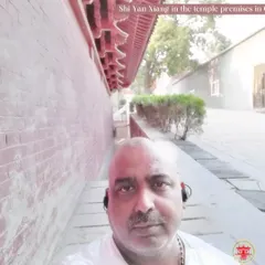 A moment of quiet reflection within the Shaolin Temple premises in China. The environment itself is a source of focus and a reminder of the deep history of Chan Buddhism and martial arts.